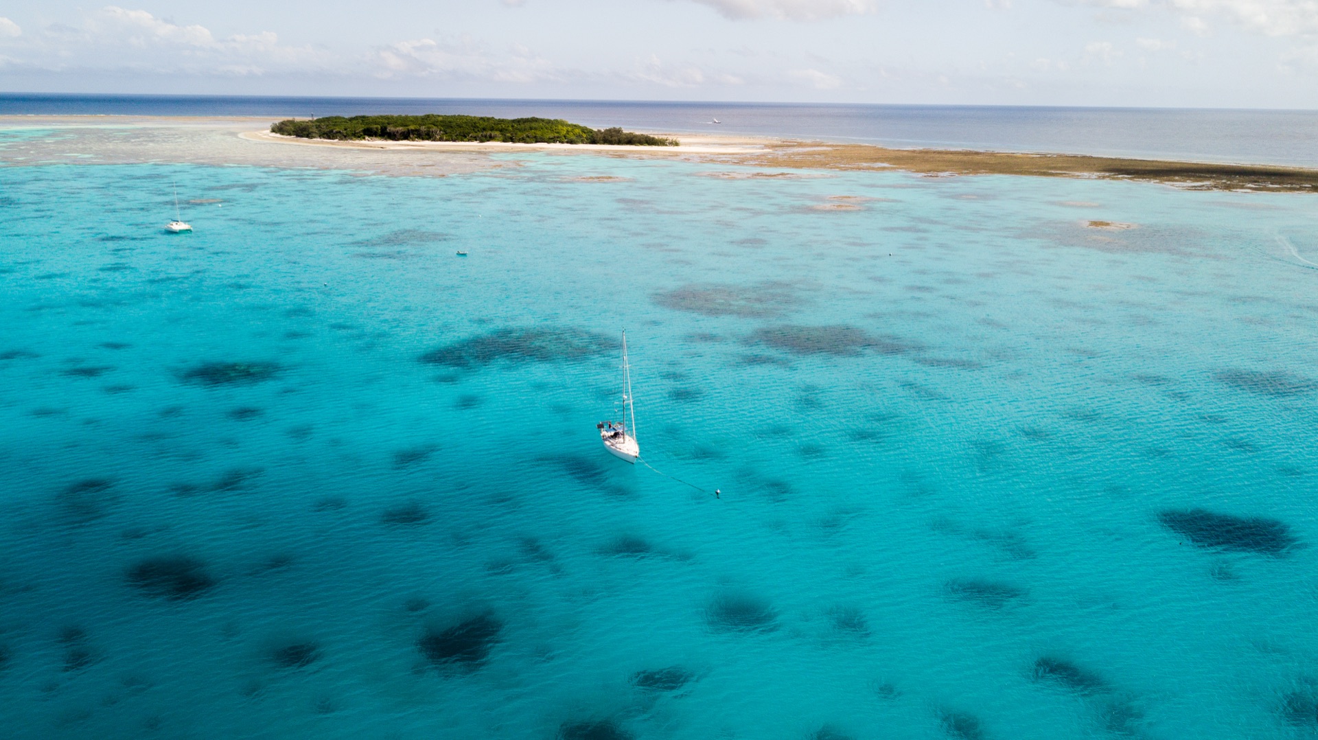 Aerial view of Bella in deep blue water
