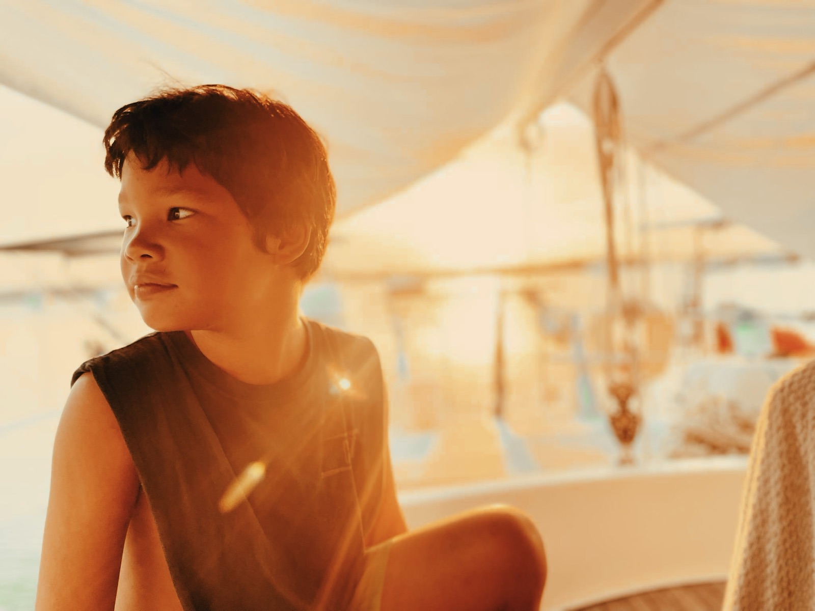 Koa aboard Bella in golden light