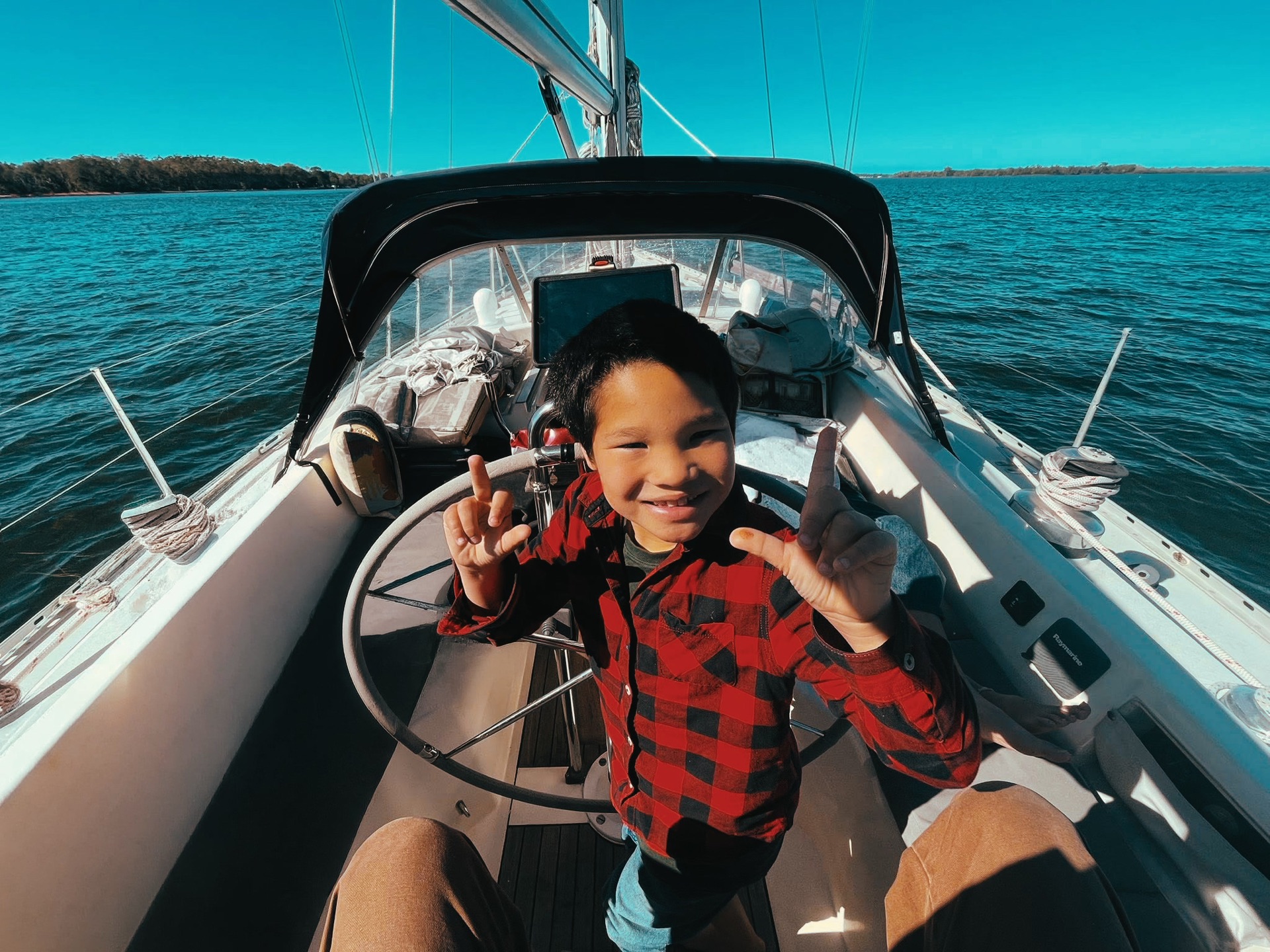 Koa at the helm, grinning
